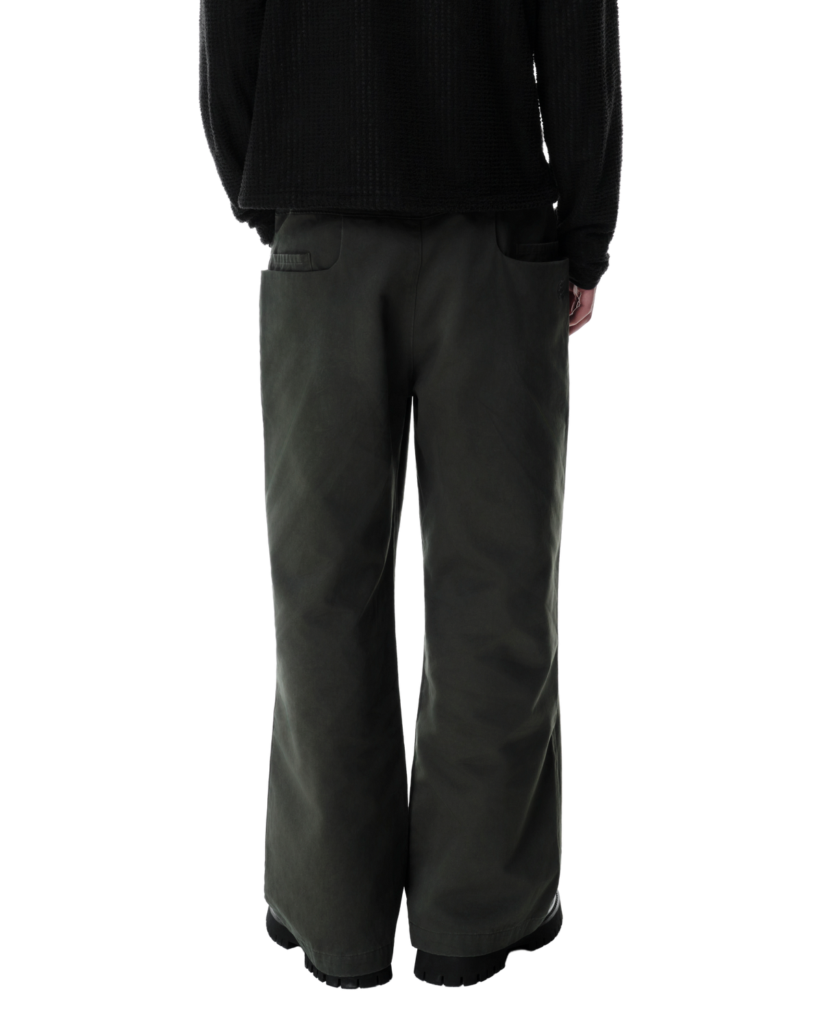 Ryg Pleated Trousers in Washed Olive Khaki, back view on model