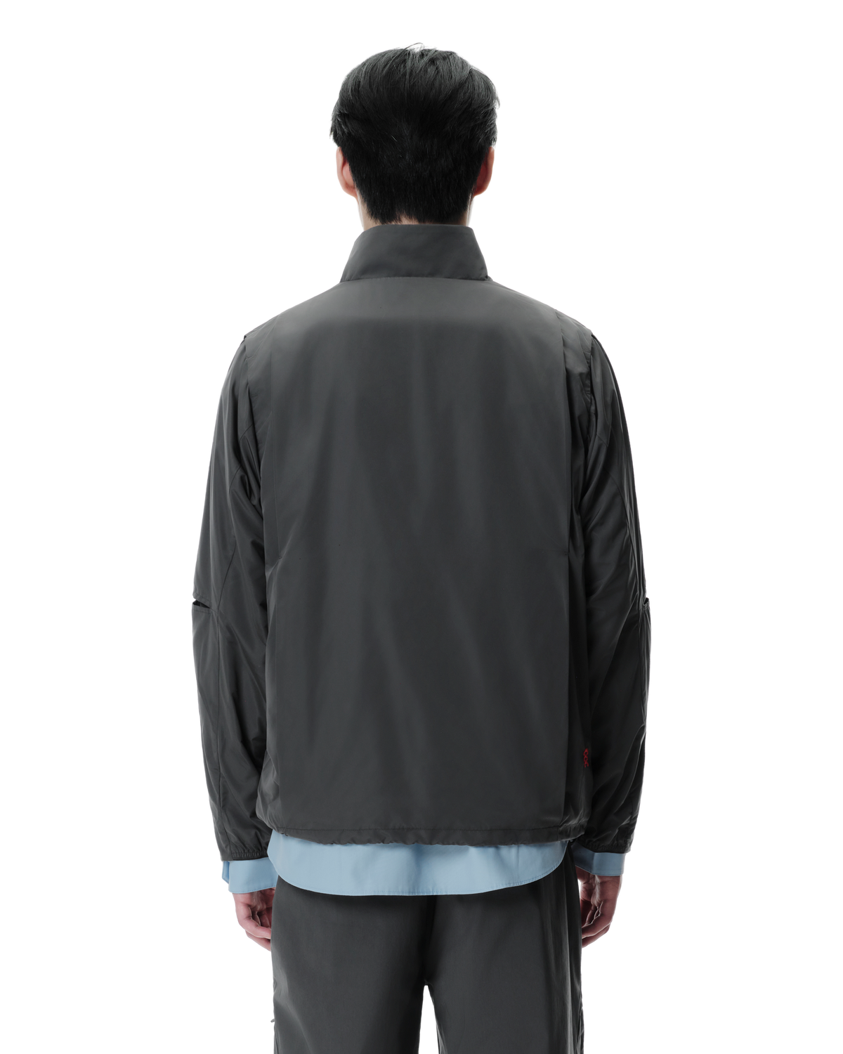 Vex Windbreaker in Grey, back view on model